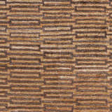 Close-up of the Addieville Area Carpet. Hand-knotted viscose rug with a contemporary geometric pattern in black, brick red, and brown. Swatch