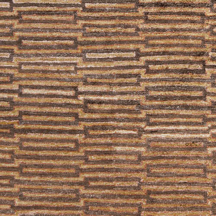 Close-up of the Addieville Area Carpet. Hand-knotted viscose rug with a contemporary geometric pattern in black, brick red, and brown. Swatch