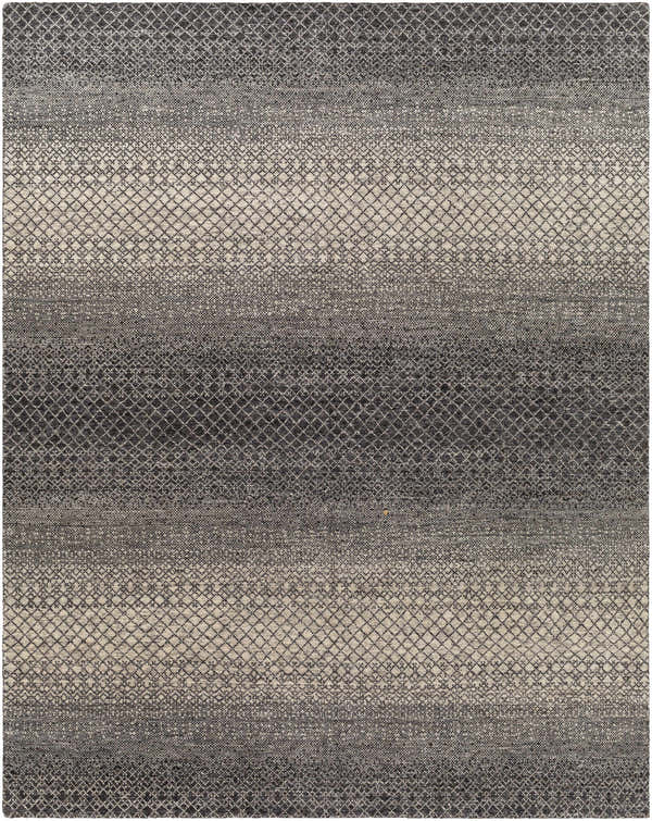 Close-up of the hand-knotted Adlay Area Rug. Bohemian style rug in black, charcoal, gray, and oatmeal with a diamond pattern. Design-Rectangle-810