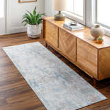 Hallway scene with light wood floors and the Ahava Washable Area Rug runner in a subtle blue and neutral abstract pattern. Roomscene-Runner