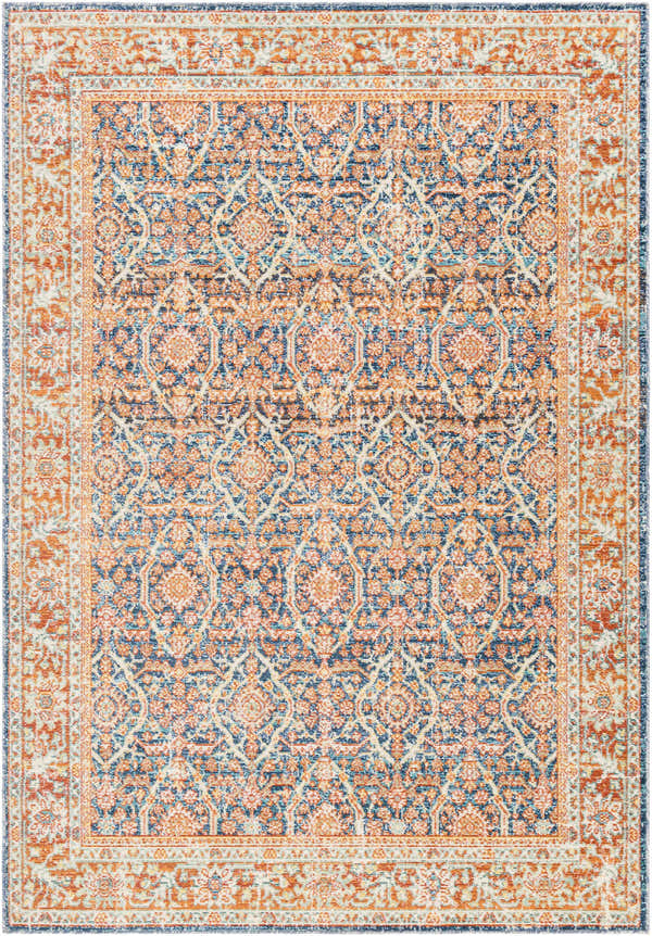 Detailed Alair Area Rug in cinnamon, clay, denim, and lambswool. Traditional floral pattern, machine woven texture. Design-Rectangle-5373