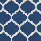 Close-up of the Alcalde Area Carpet. Hand-woven cotton rug with a bright blue background and an ivory quatrefoil pattern. Swatch