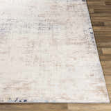 Close-up of the Alcove Abstract Area Rug showing its ivory, gray, and blue contemporary design and soft texture. Front