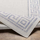 Close-up of Alen Cream & Blue Indoor Outdoor Rug showing geometric Greek key pattern and textured weave. Fold
