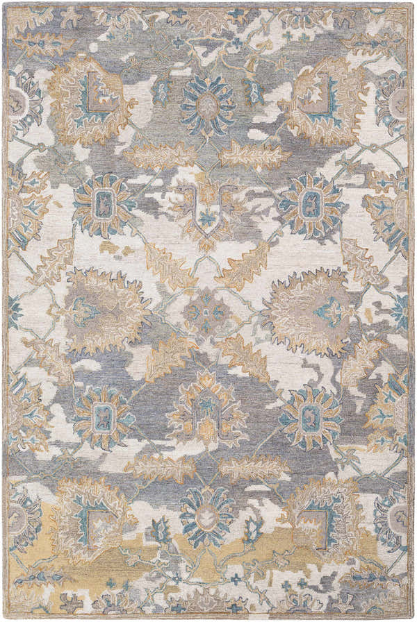 Close-up of the Ancho Area Rug, a hand-tufted wool rug with a traditional floral pattern in blue, brown, and ivory tones. Design-Rectangle-576