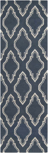 Close-up of the Anchorage Area Carpet, a hand-woven wool rug with a cream geometric pattern on a dark blue background. Design-Runner-268