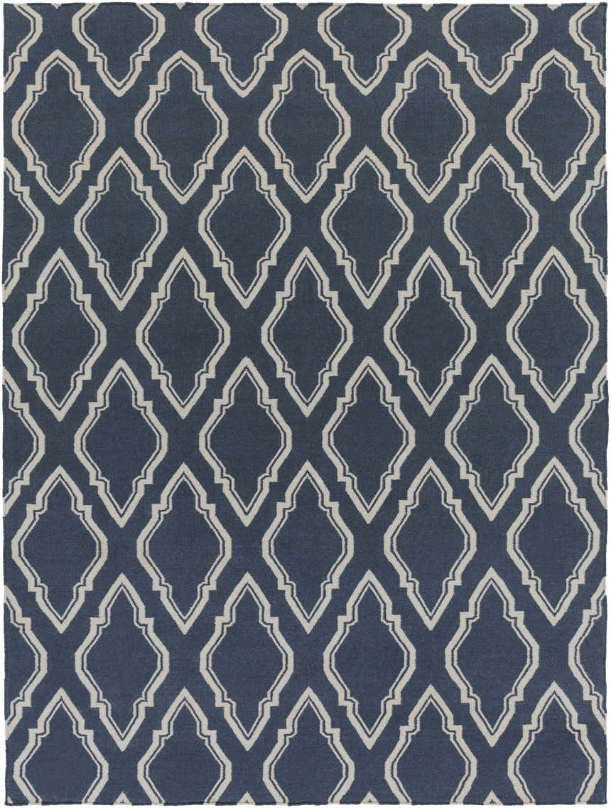 Close-up of the Anchorage Area Carpet; a hand-woven wool rug with cream geometric trellis pattern on a dark blue background. Design-Rectangle-811