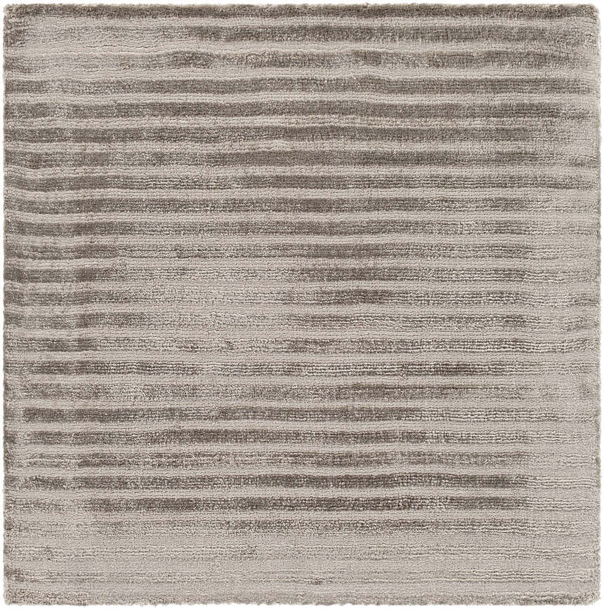 Close-up of the hand-loomed Angie Area Rug in charcoal, featuring a contemporary striped pattern and soft viscose texture. Swatch