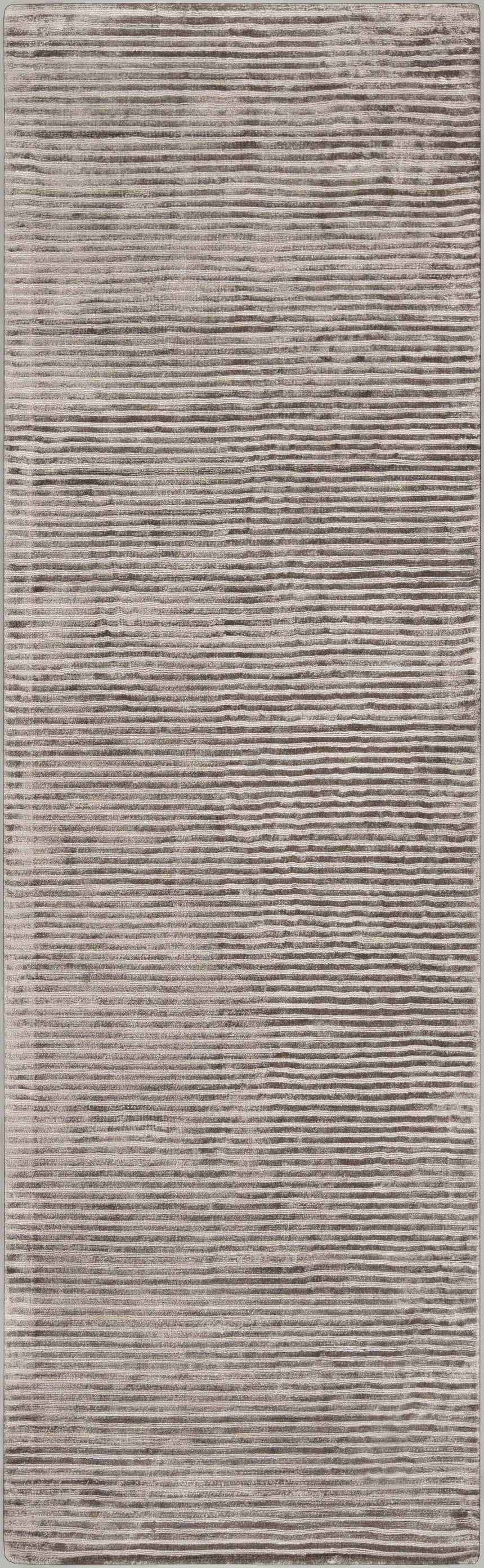 Close-up of the Angie Area Rug. Charcoal rug with a subtle striped pattern and soft, viscose texture. Design-Runner-268