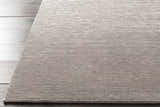 Close-up of the charcoal Angie Area Rug. This hand-loomed rug has a subtle striped pattern and soft viscose texture. Front