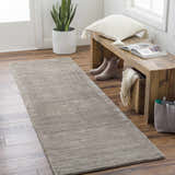 Entryway with wood floors and charcoal Angie Area Rug runner, bench with pillow, and decor. Roomscene-Runner