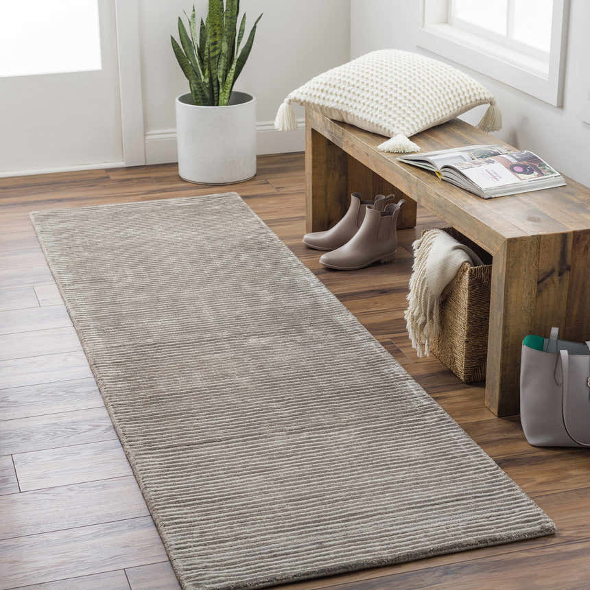 Entryway with wood floors and charcoal Angie Area Rug runner, bench with pillow, and decor. Roomscene-Runner