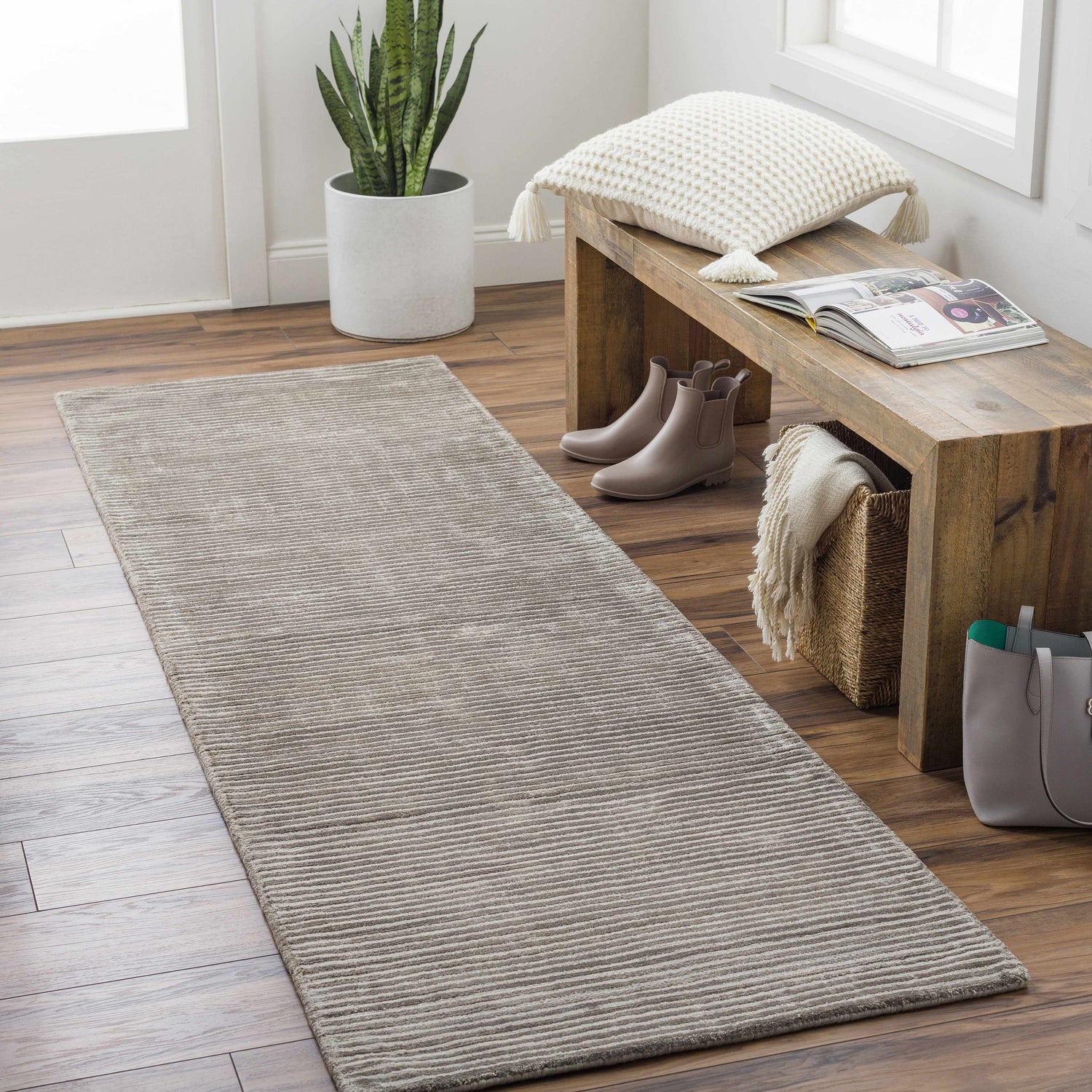 Entryway with wood floors and charcoal Angie Area Rug runner, bench with pillow, and decor. Roomscene-Runner