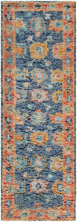 Close-up of the Ankara Premium Wool Area Rug. Hand-knotted rug with a blue, coral, and mustard bohemian pattern. Design-Runner-268