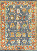 Close-up of the Ankara Premium Wool Area Rug, featuring a traditional design in aqua, orange, and navy. Hand-knotted texture. Design-Rectangle-912