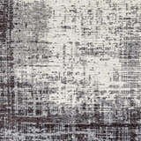Close-up of the Binh Gray Area Rug, showcasing its charcoal, cream, and slate contemporary design and chenille-polyester texture. Swatch