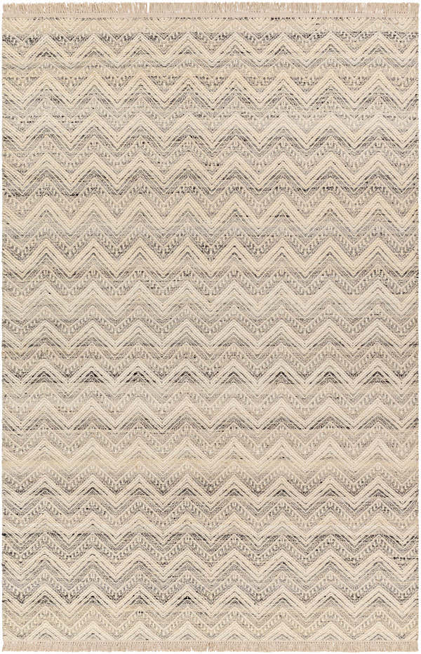 Close-up of the Aqeel Area Rug. Hand-woven wool rug with a light brown and gray chevron pattern and fringe. Design-Rectangle-576