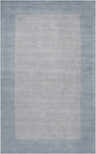 Close-up of the Arkabutla Solid Blue Bordered Wool Rug, featuring a medium gray center and an ice blue border. Design-Rectangle-58