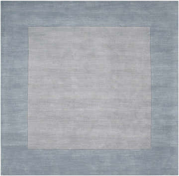 Close-up of the hand-loomed Arkabutla Solid Blue Bordered Wool Rug, featuring ice blue and medium gray colors. Design-Square-8