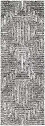 Close-up of Artois Area Rug featuring a geometric pattern in black, cream, gray, and slate blue. Design-Runner-2773