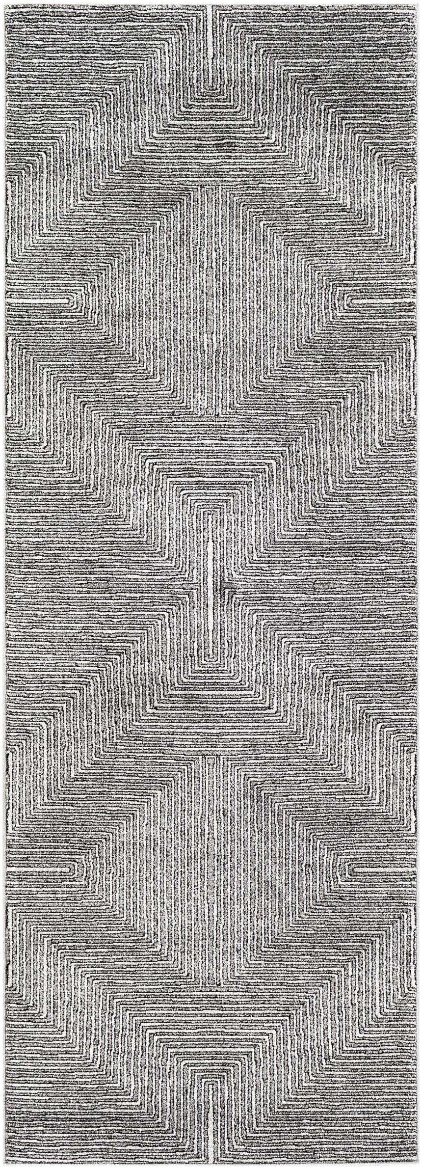 Close-up of Artois Area Rug featuring a geometric pattern in black, cream, gray, and slate blue. Design-Runner-2773