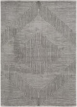 Close-up of the Artois Area Rug, a black, cream, and gray rug with a geometric, linear pattern. Design-Rectangle-5373