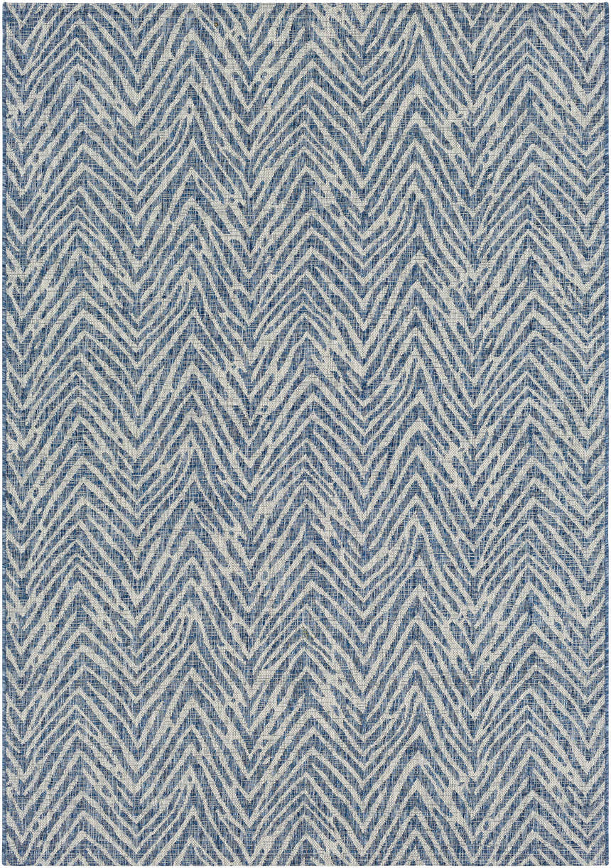 Close-up of the Ashcamp Area Rug, featuring a blue and taupe chevron pattern and textured weave. Coastal style. Design-Rectangle-5376