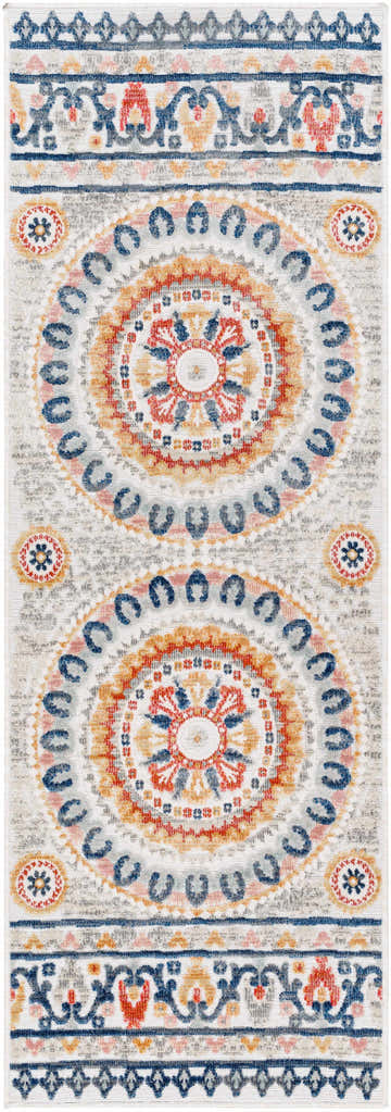 Close-up of the Asis Area Rug. Floral medallions in clay, dark beige, denim, and gray on a natural gray background. Design-Runner-2773