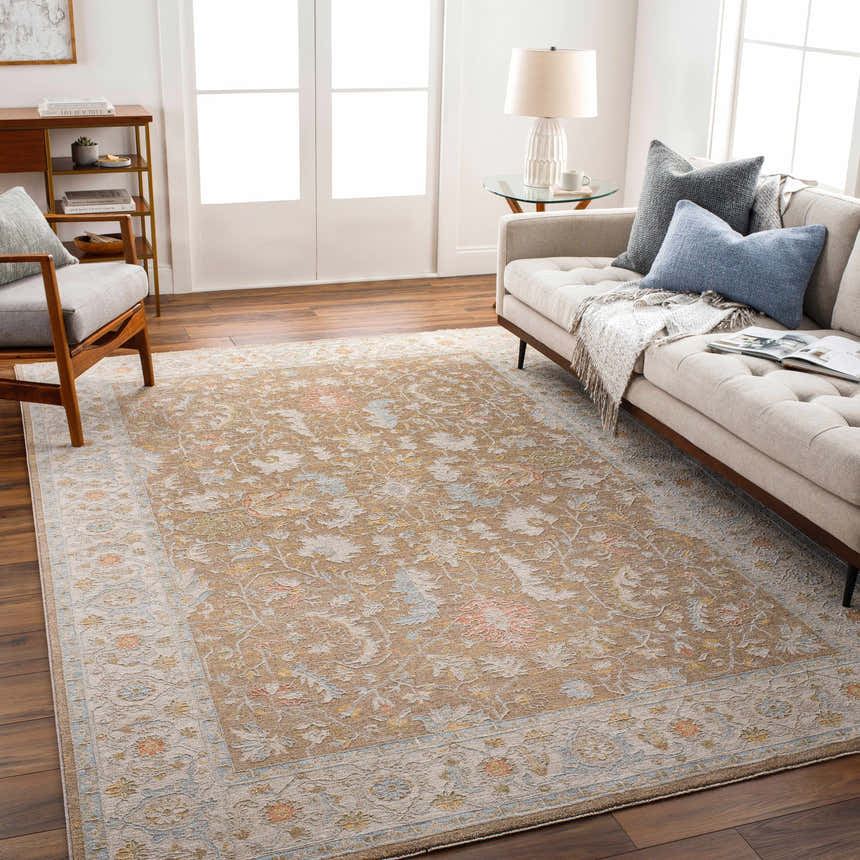 Living room with Atli Thick Luxe Area Rug in amber, brown, pink, and gray. Farmhouse style with sofa, chair, and wood floors. Roomscene-Rectangle