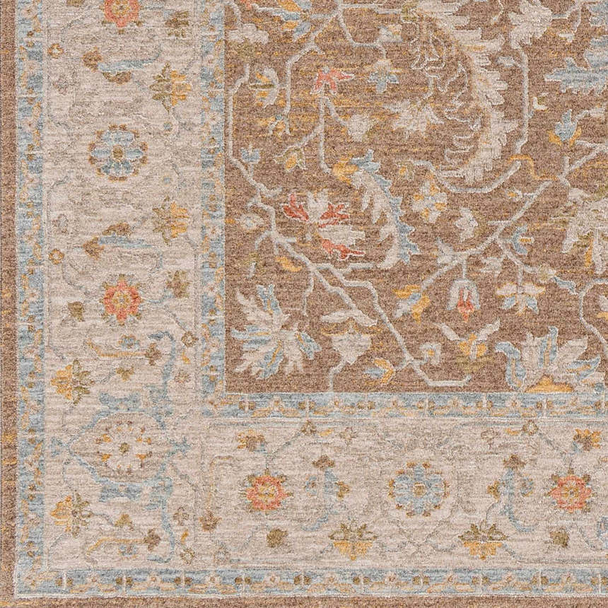 Close-up of the Atli Thick Luxe Area Rug, showcasing its traditional floral pattern in amber, brown, pink, and gray hues. Swatch