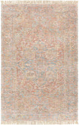 Close-up of the hand-woven Atulayan Premium Rug. Bohemian style rug with blue, coral, and red tones and fringe detail. Design-Rectangle-576
