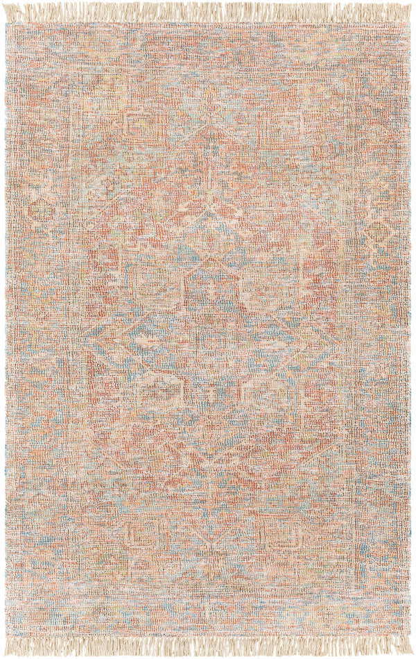 Close-up of the hand-woven Atulayan Premium Rug. Bohemian style rug with blue, coral, and red tones and fringe detail. Design-Rectangle-576