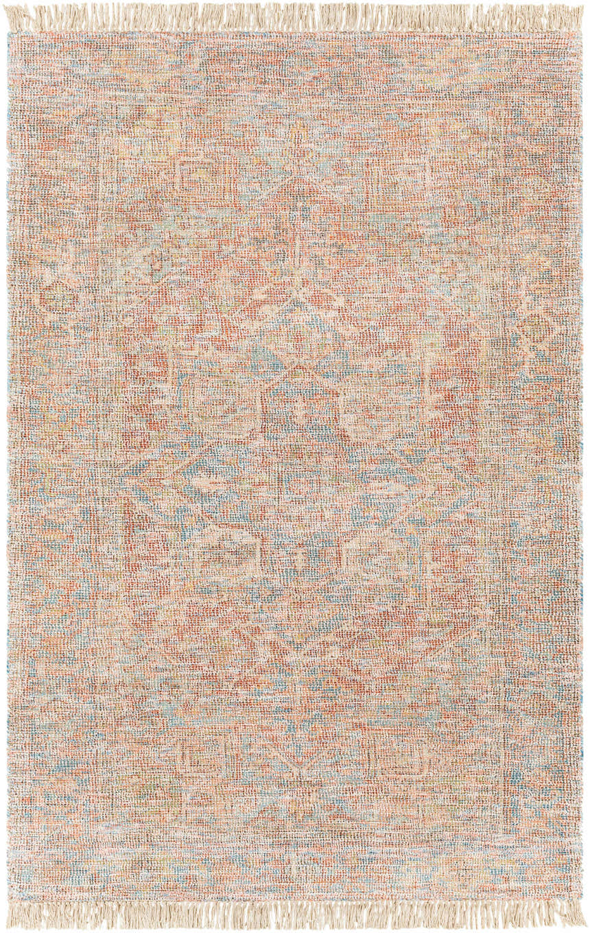 Close-up of the hand-woven Atulayan Premium Rug. Bohemian style rug with blue, coral, and red tones and fringe detail. Design-Rectangle-576
