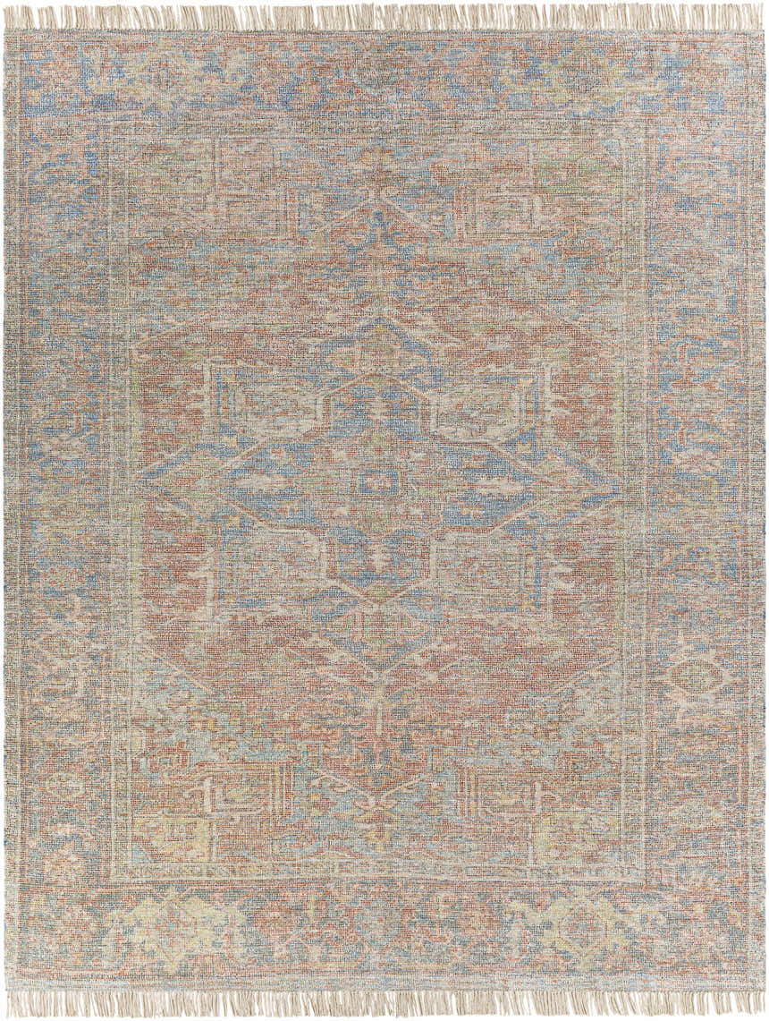 Close-up of the hand woven Atulayan Premium Rug. Bohemian style rug in blue, burgundy, and coral with fringe. Design-Rectangle-810