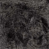 Close-up of the ink blue Auxier Area Rug. Hand-woven polyester shag rug texture. Contemporary style. Texture