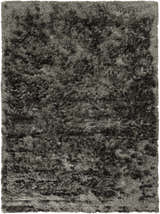 Close-up of the Ink Blue Auxier Area Rug. Contemporary shag rug with a hand-woven texture. Design-Rectangle-811