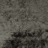 Close-up of the hand-woven Auxier Area Rug. Ink blue and teal polyester shag rug with a contemporary design. Swatch