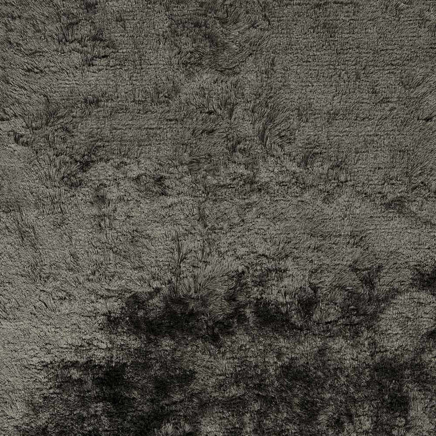 Close-up of the hand-woven Auxier Area Rug. Ink blue and teal polyester shag rug with a contemporary design. Swatch
