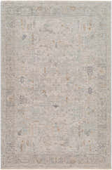 Close-up of the Ayarn Thick Luxe Statement Rug. Machine-woven polyester rug in brown, charcoal, teal, sage, and gray. Design-Rectangle-575