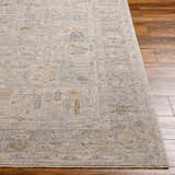 Close-up of the Ayarn Thick Luxe Statement Rug showing its traditional brown, teal, and gray pattern and textured weave. Front