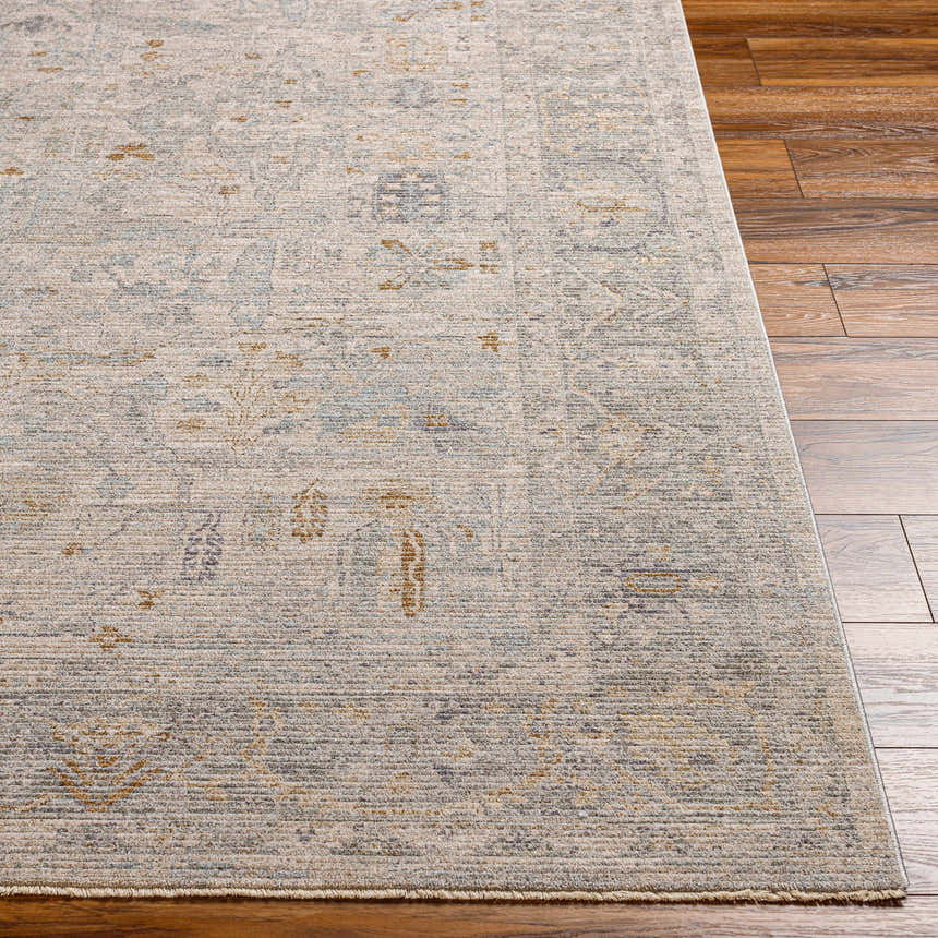 Close-up of the Ayarn Thick Luxe Statement Rug showing its traditional brown, teal, and gray pattern and textured weave. Front