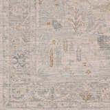 Close-up of Ayarn Thick Luxe Statement Rug. Machine-woven polyester rug in brown, teal, sage, and gray with traditional patterns. Swatch