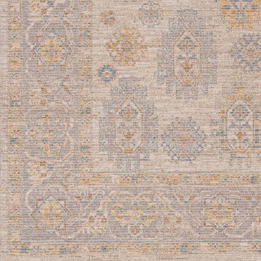 Close-up of the Ayele Thick Luxe Statement Rug showing its traditional pattern in charcoal, gray, and mustard tones. Swatch