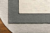 Close-up of the Innisfail Area Rug showing the black and medium gray striped pattern and hand woven texture. Styleshot