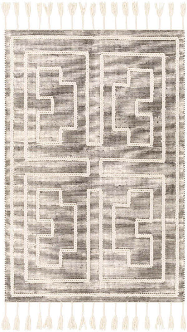 Close-up of the Azra Tasseled Jute & Wool Rug. Charcoal rug with a cream geometric pattern and tassels. Design-Rectangle-576