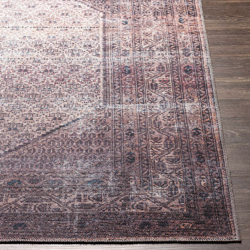 Close-up of the Dusty Pink Bagacay Distressed Washable Area Rug showing its oriental pattern and soft texture. Front