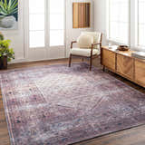 Living room scene with Dusty Pink Bagacay rug, cream chair, and wood cabinet on dark wood floors. Roomscene-Rectangle