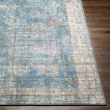 Close-up of the Bagontapay Washable Area Rug. Features blue, cream, and rose tones with an oriental-inspired pattern. Front