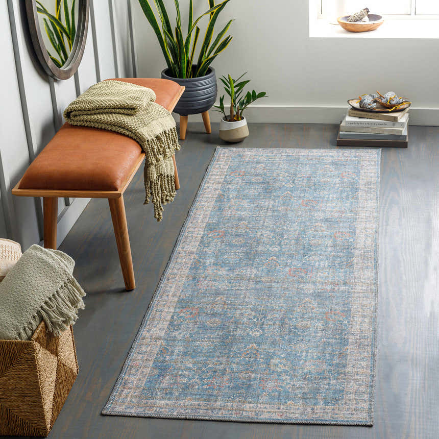 Entryway with blue Bagontapay Washable Area Rug, wood bench, woven basket, and plants for a coastal farmhouse feel. Roomscene-Runner