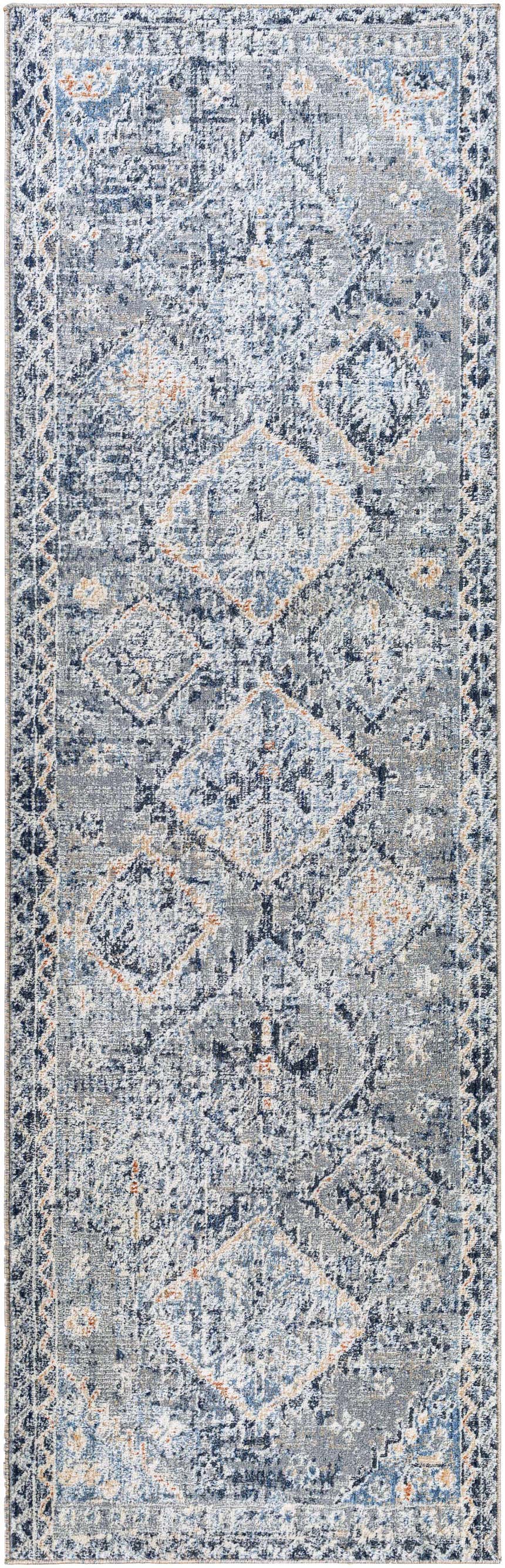 Close-up of the Balamban Area Rug. Bohemian style rug in brick red, cream, denim, gray, light beige, and navy. Design-Runner-268
